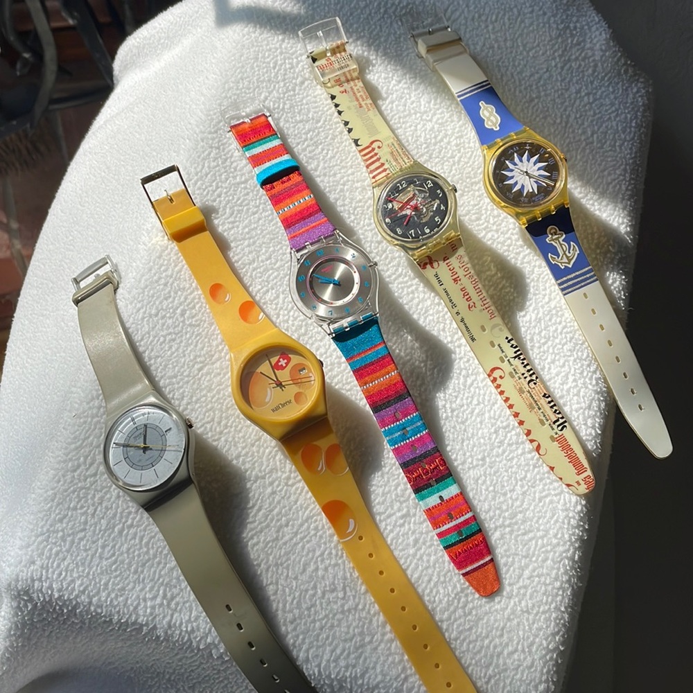 5 swatch watches.  All included